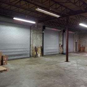 Warehouse interior showing three dock loading doors