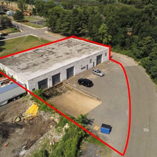 Aerial view of warehouse property showing property bounds